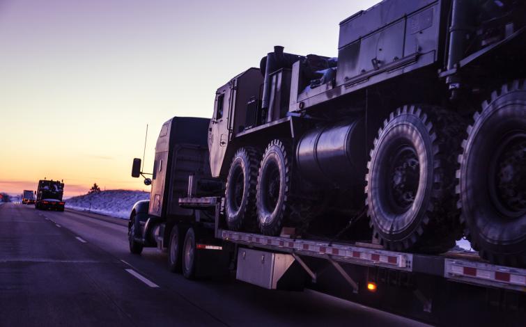 Truck Hauling Military Equipment